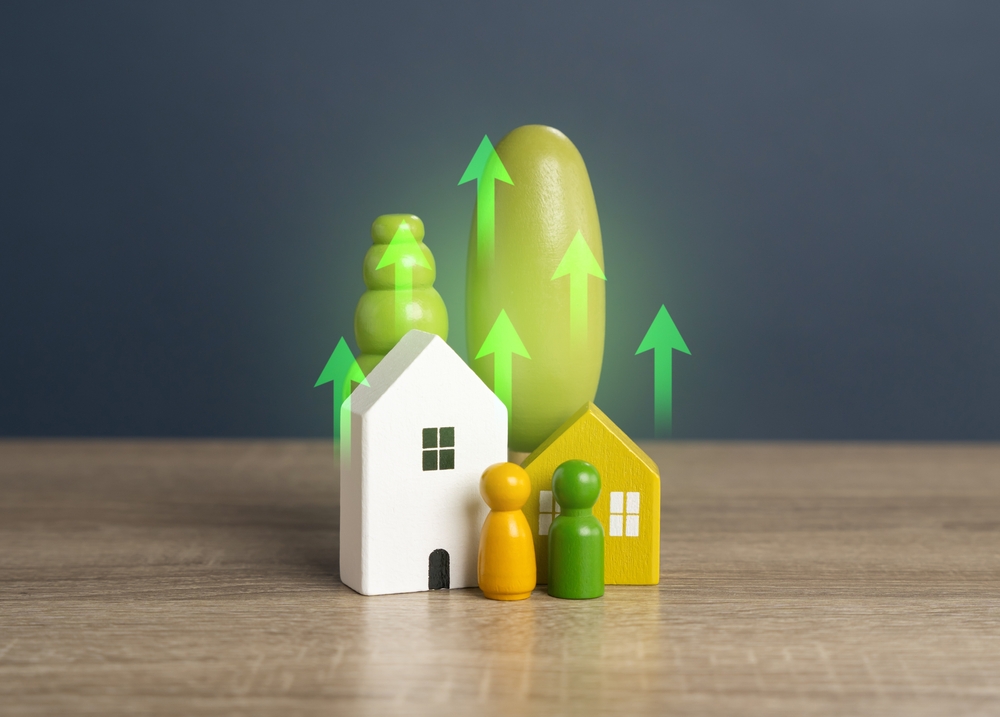 house model with green upward arrows